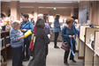 Patrons attending a wine and cheese social at the public library