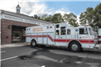 Rescue 1 truck in front of bays at Company 1 