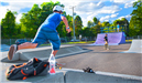Children riding skate boards at skate park