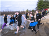 Members of the Newington Police Department entering the ice cold water