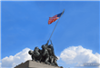 Memorial depicting military members raising United States of America flag