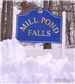 Sign at Mill Pond Falls depicting snow at base during winter