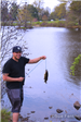Man showing his catch at Mill Pond