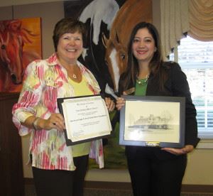 Library Board President Anna Eddy with American Eagle Federal Credit Union Newington Branch Manager Pam Golchin