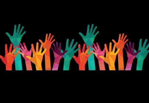 Colorful raised hands on black background
