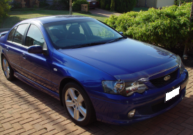 Blue Ford Falcon parked in driveway