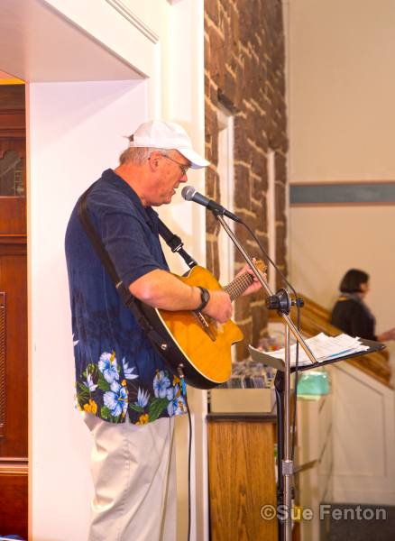 Patrons attending a wine and cheese social at the public library