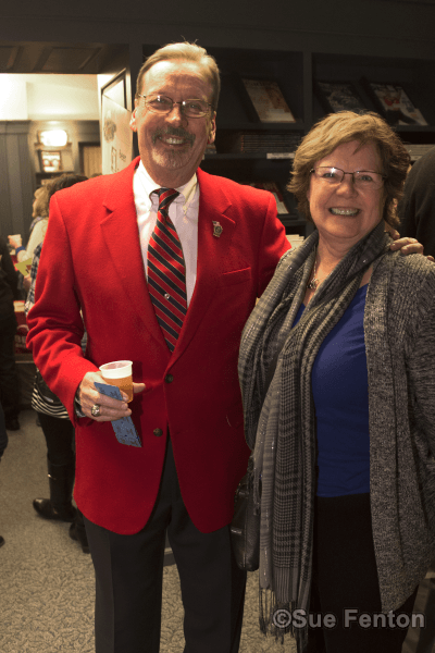 Patrons attending a wine and cheese social at the public library
