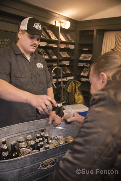 Patrons attending a wine and cheese social at the public library