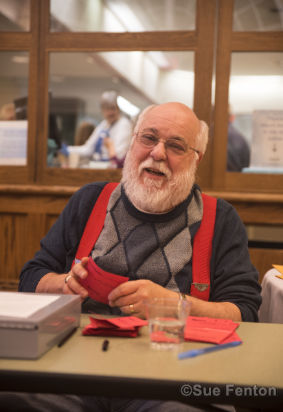 Patrons attending a wine and cheese social at the public library