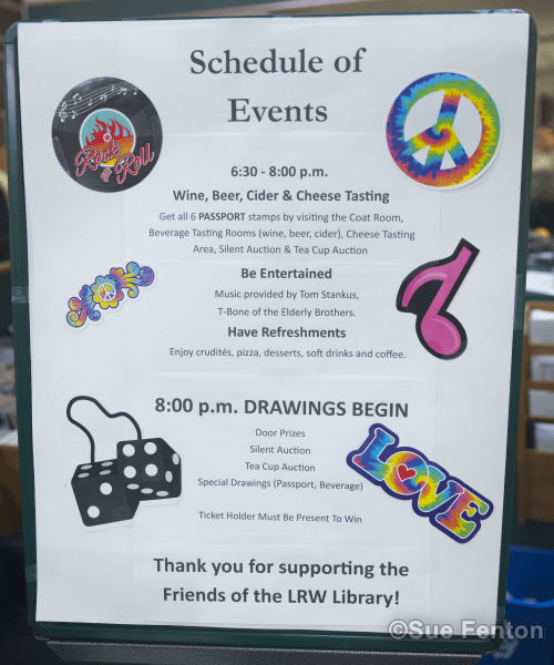Patrons attending a wine and cheese social at the public library
