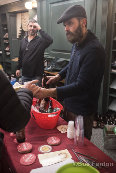Patrons attending a wine and cheese social at the public library