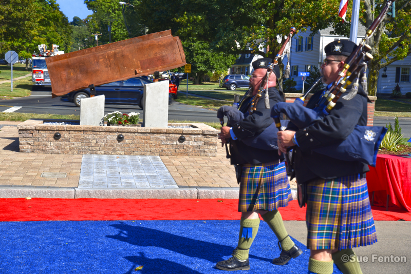 Bagpipers playing as they march by September 11, 2001 Memorial during dedication ceremony