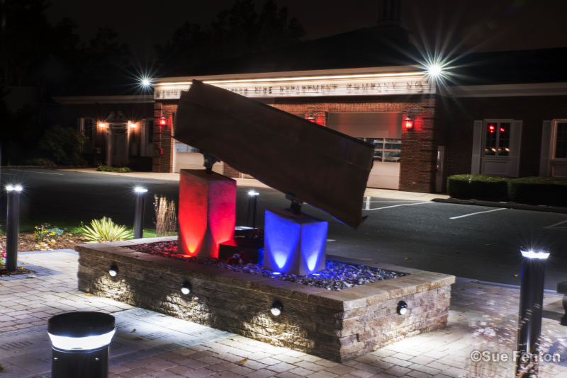 Night time photo of LED lighting illuminating September 11, 2001 Memorial