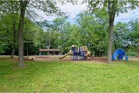 Churchill Park Playground - Before Renovation, featuring slides and climbing obstacles