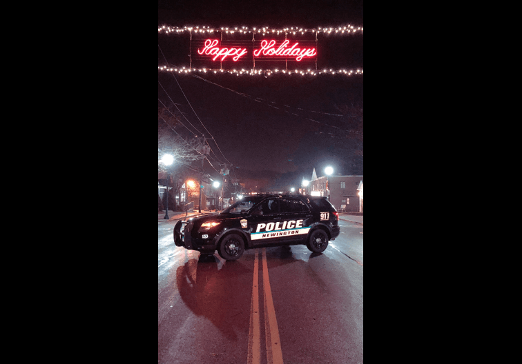 NEWINGTON POLICE CRUISER UNDER HAPPY HOLIDAYS SIGN ON MARKET SQUARE