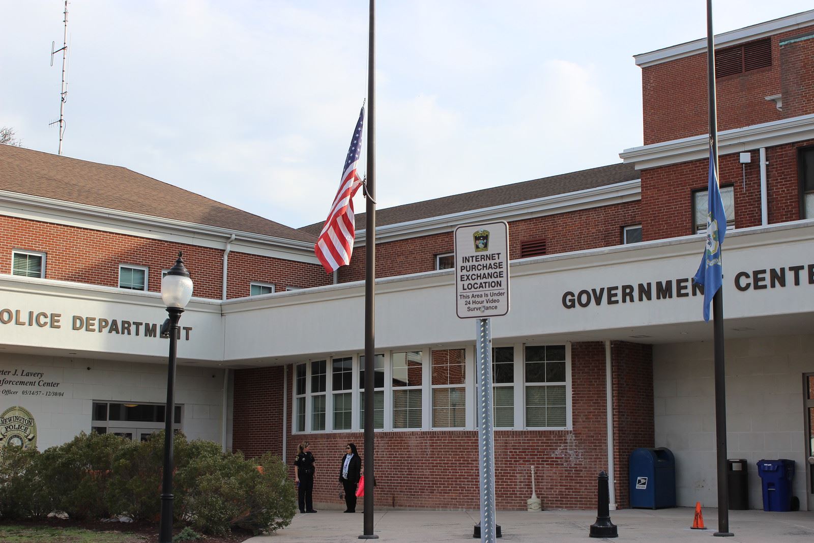 Sign Reading Internet Purchase Exchange Location in Police Department ParkingSpot