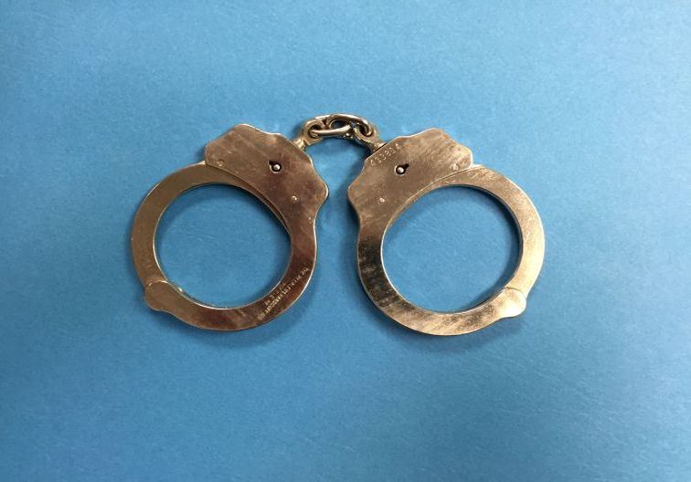 Handcuffs on a blue background