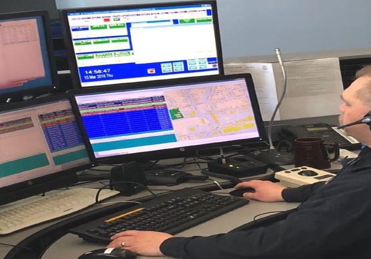 Dispatcher at a communications console.