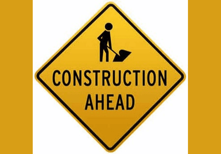 Yellow and Black diamond with Construction Ahead 