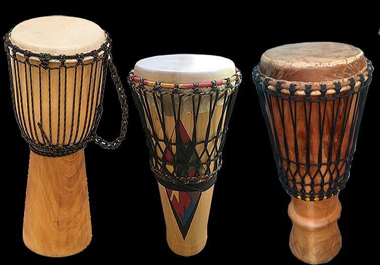 Three hand drums on a black background