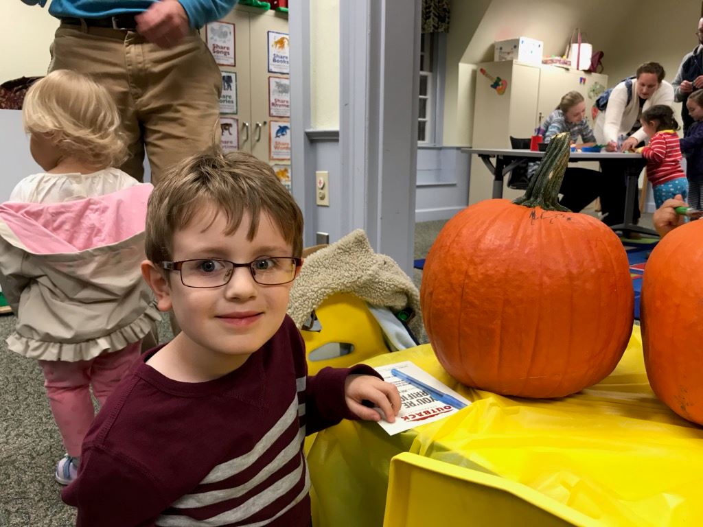 Joey decorating his pumpkin