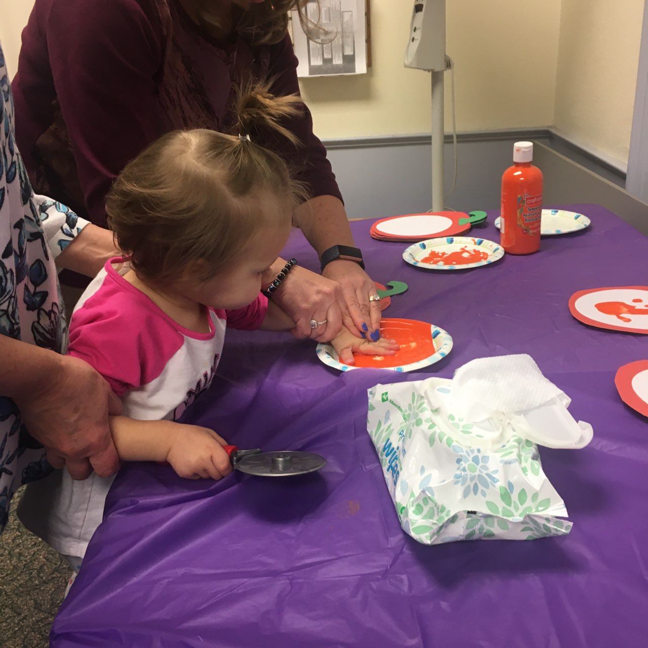 young girl making handprint
