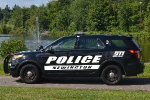 Police Cruiser in front of Mill Pond